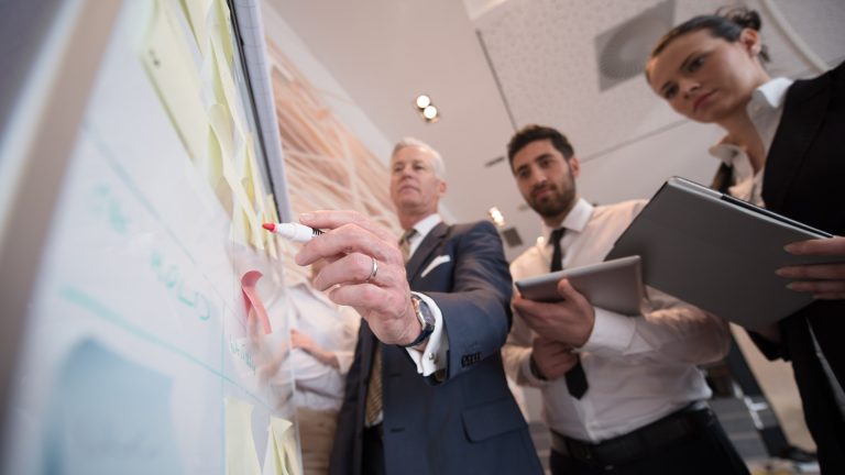 Three sales men planning