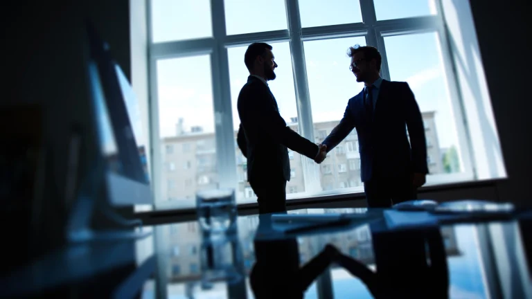 Two men shadows closing deal