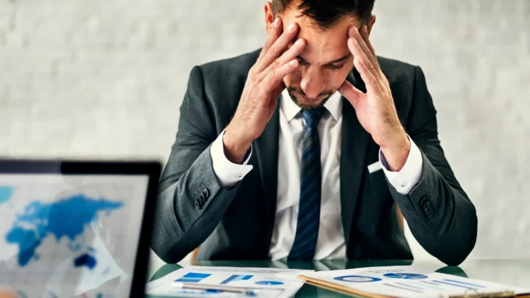Man holding his head disappointed of mistakes in contingency exit