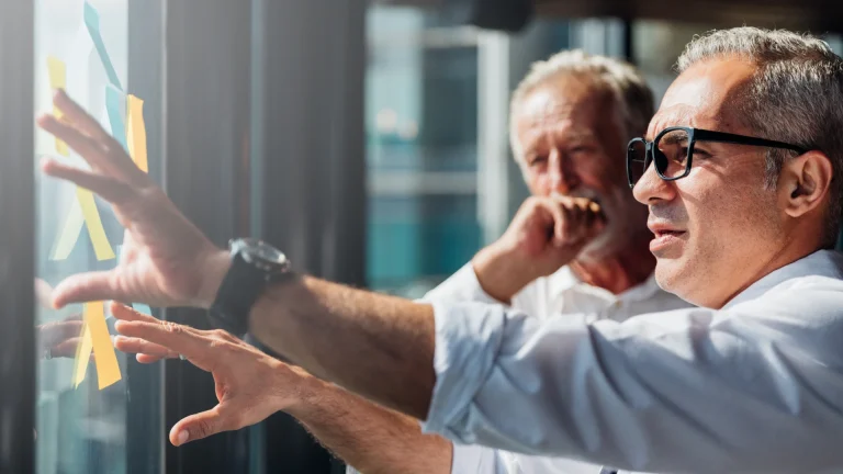 2 men researching about types of business buyers