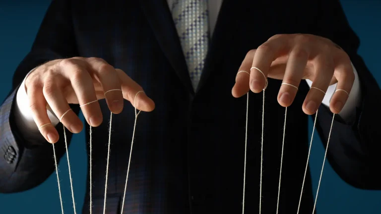 Hands with puppet strings like owner-operators