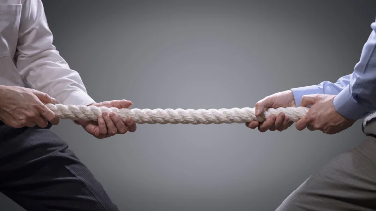 Tug of war showing how business partnership is hard