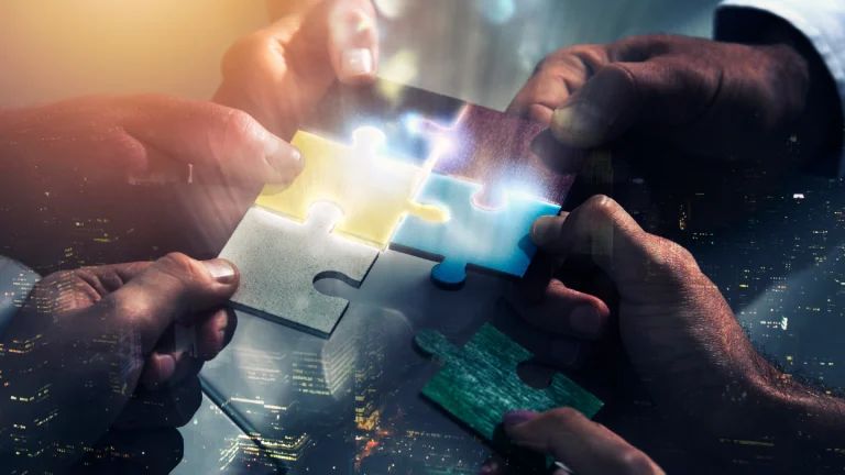 People connecting puzzles showing innovation velocity